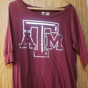 Cute, maroon ladies Texas  A&M shirt with 3/4 sleeve, scoop neck.